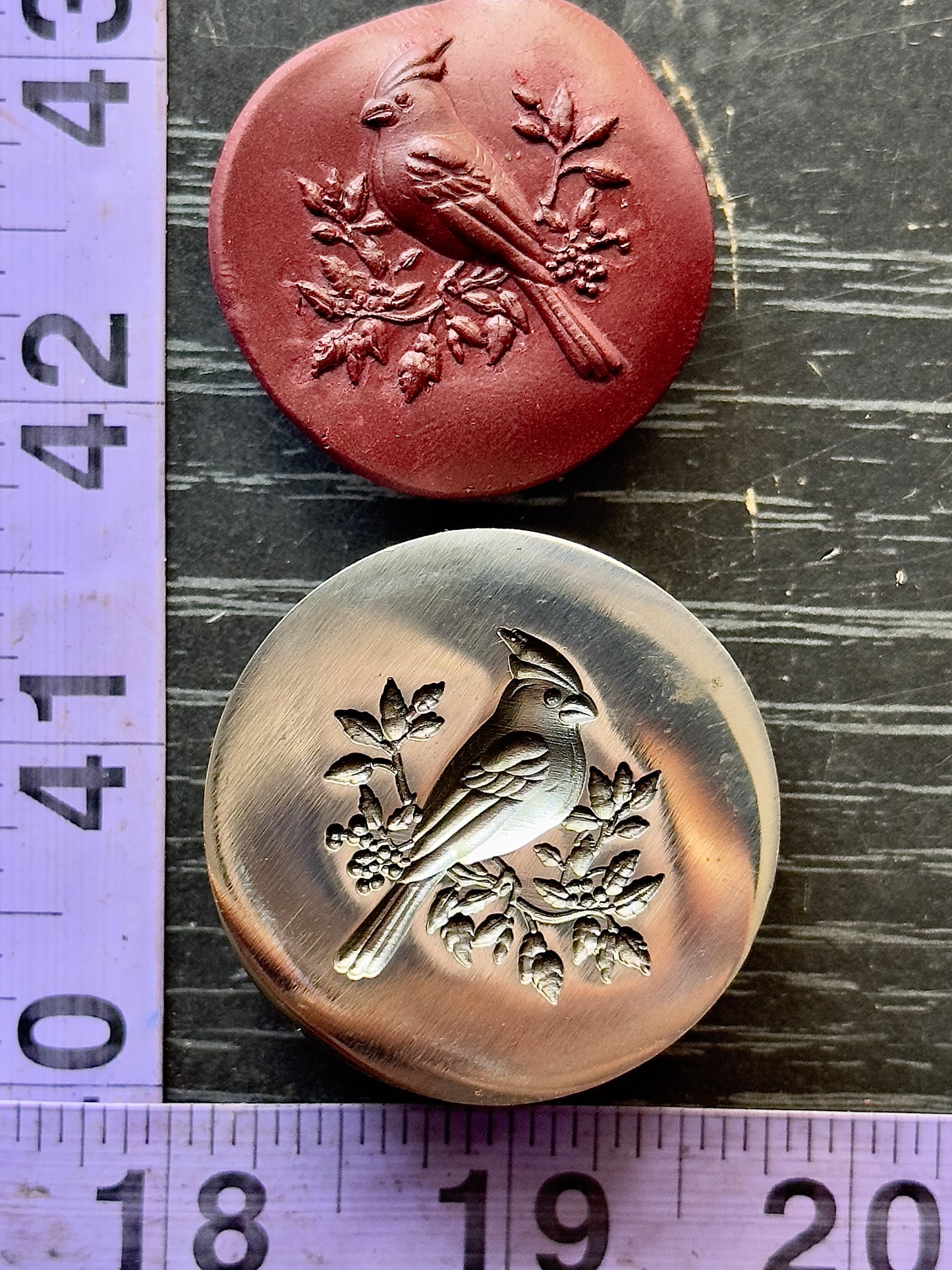 The Red Cardinal steel impression die