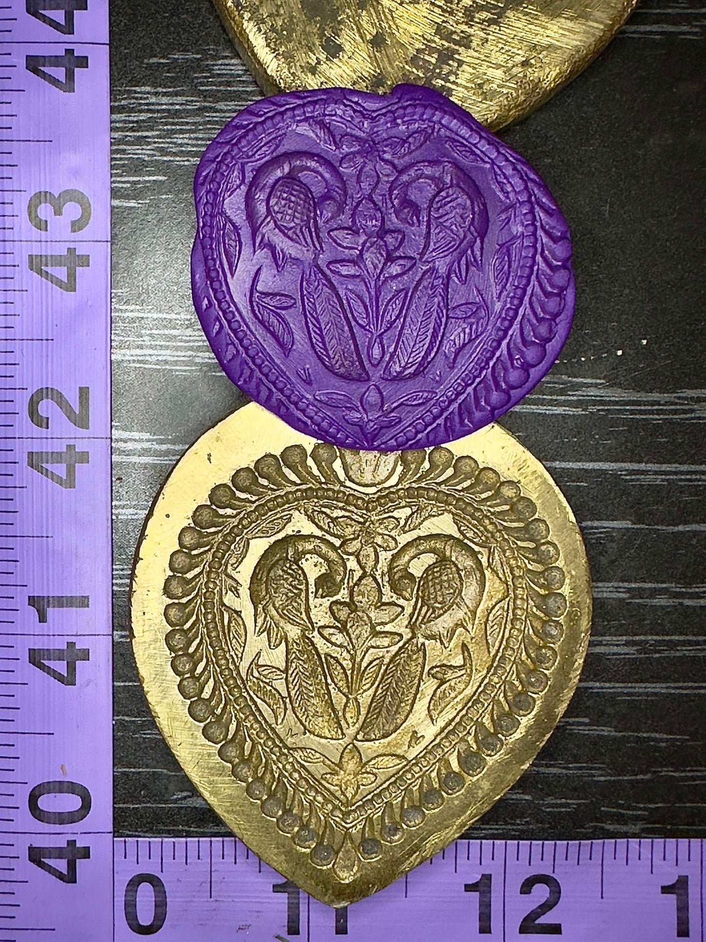 Mirrored peacocks in teardrop shaped design vintage bronze