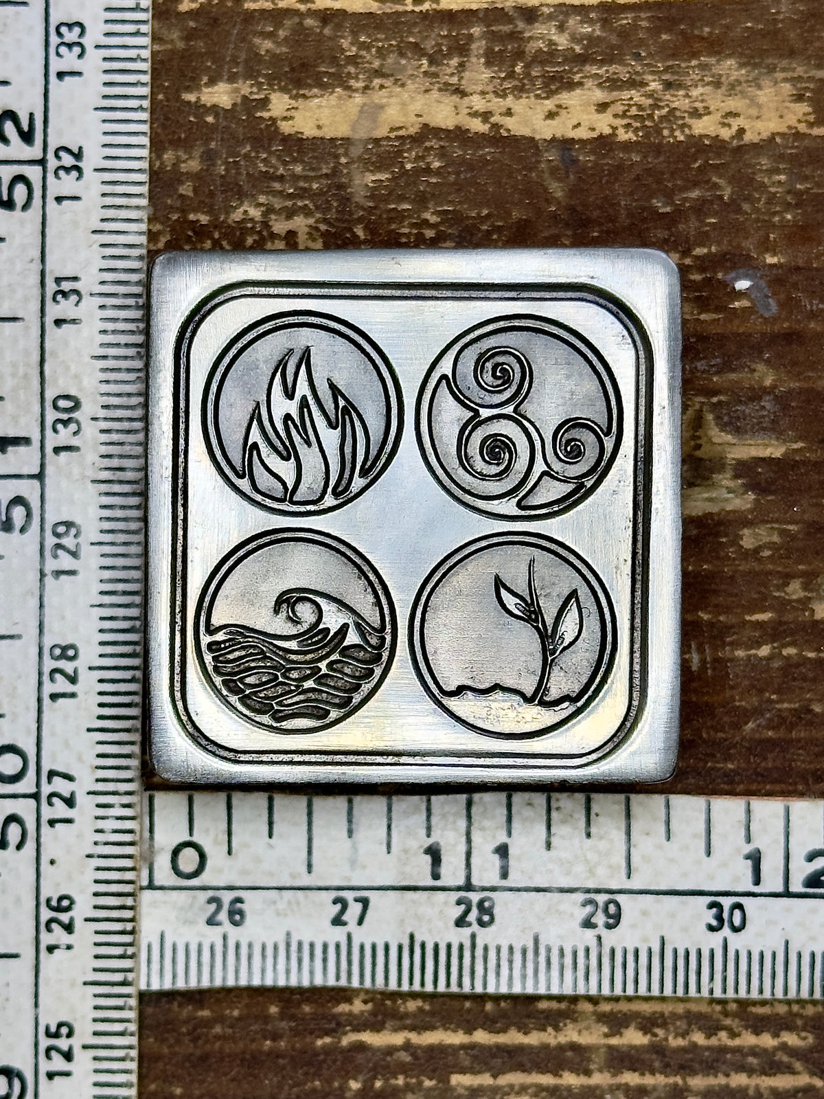 The four elements buttons steel impression die
