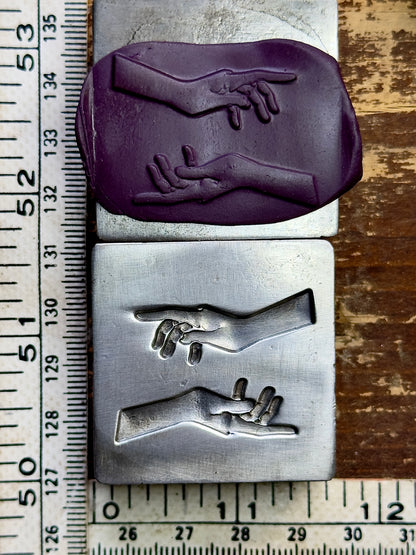 Magic hands steel impression die