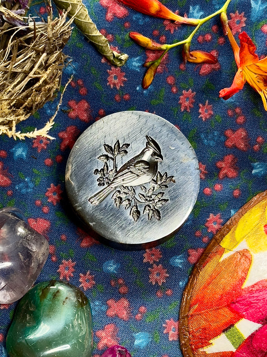 The Red Cardinal steel impression die