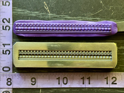 Double dot steel impression die