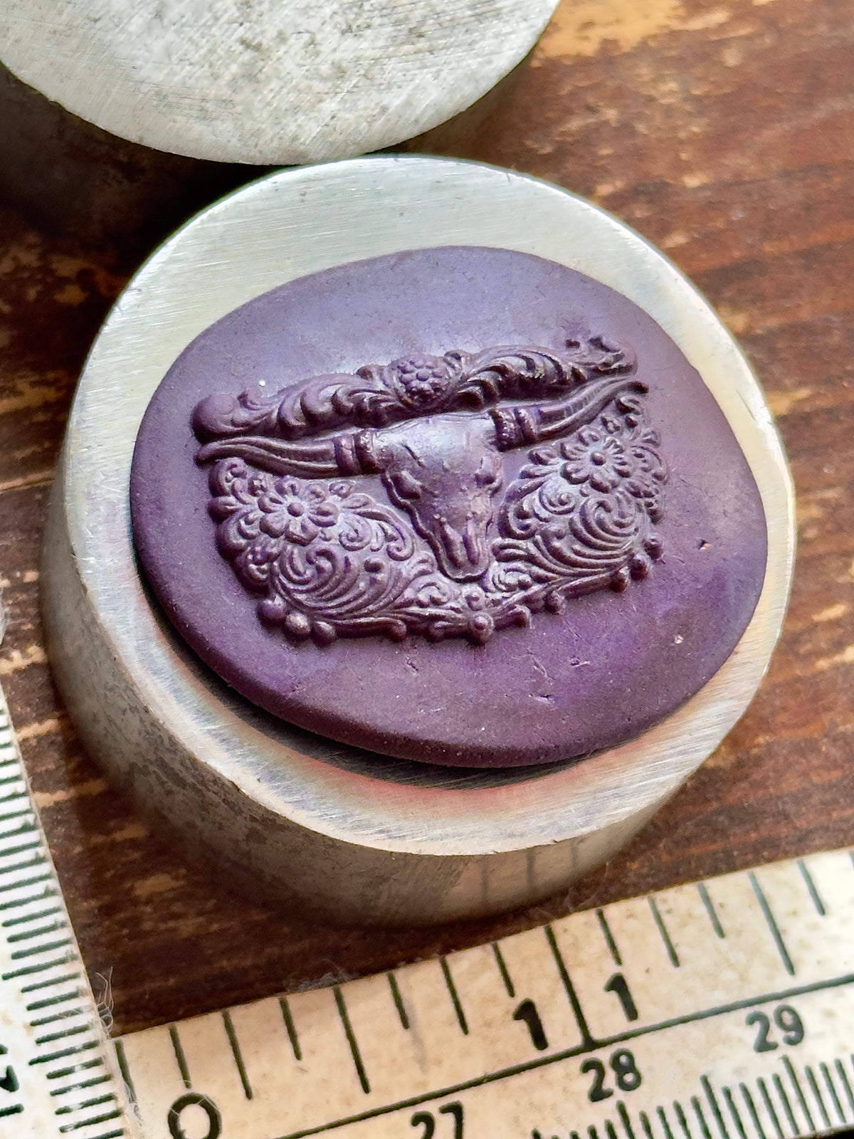 SW style longhorn with tooled leather background steel impression die