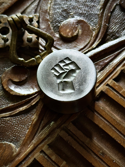 Raised fist, resist impression die