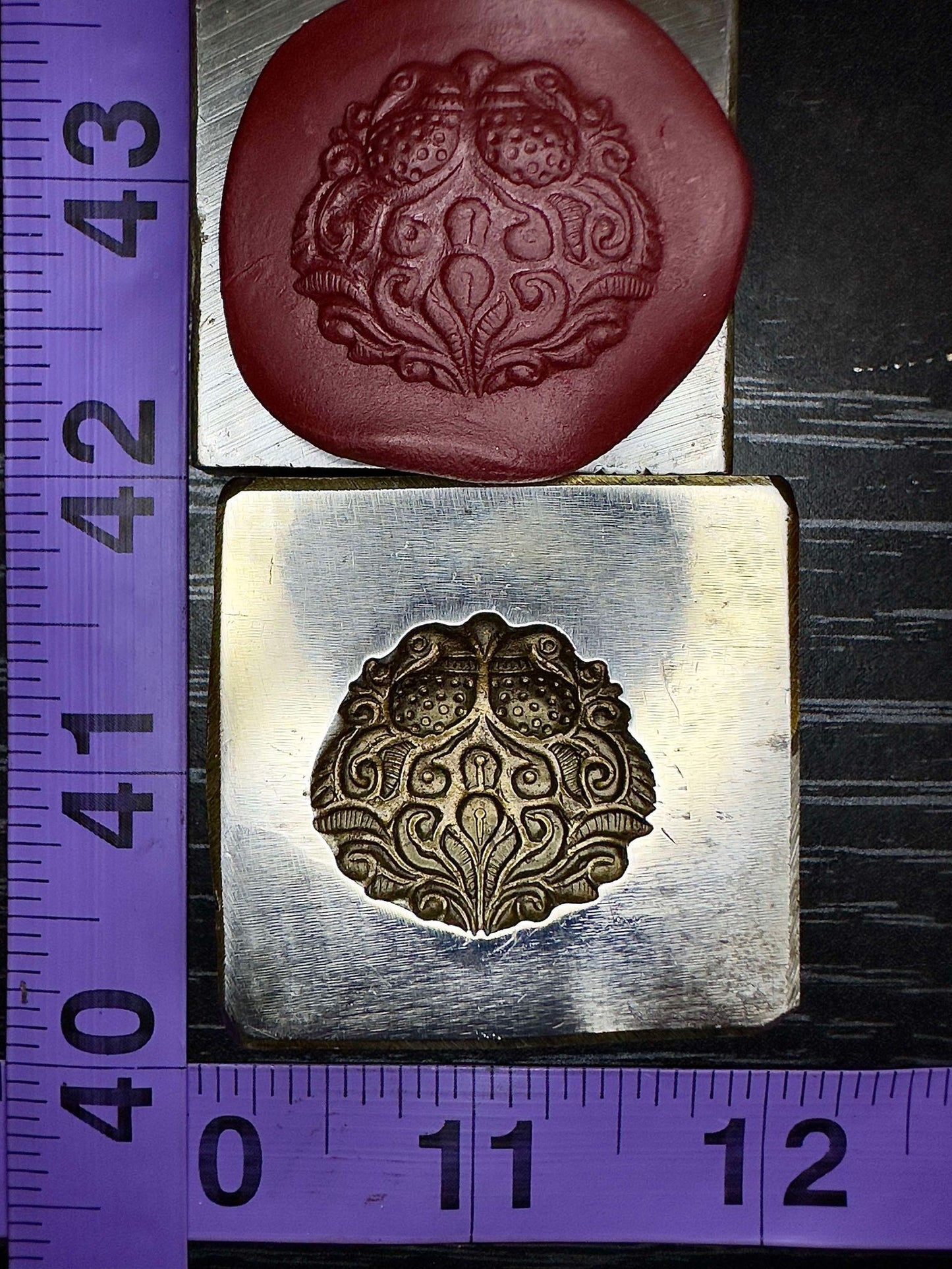 Mirrored peacocks impression die